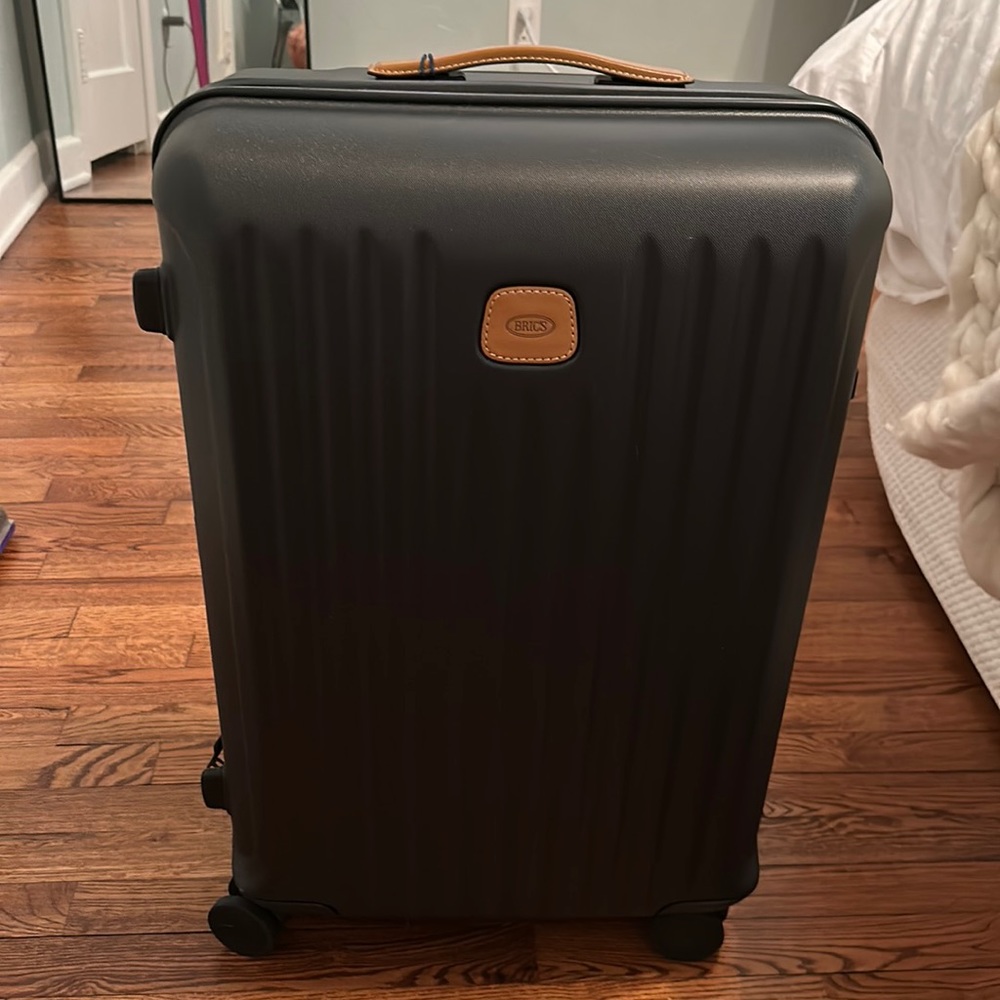 Brand new Bric’s luggage with dust bag.